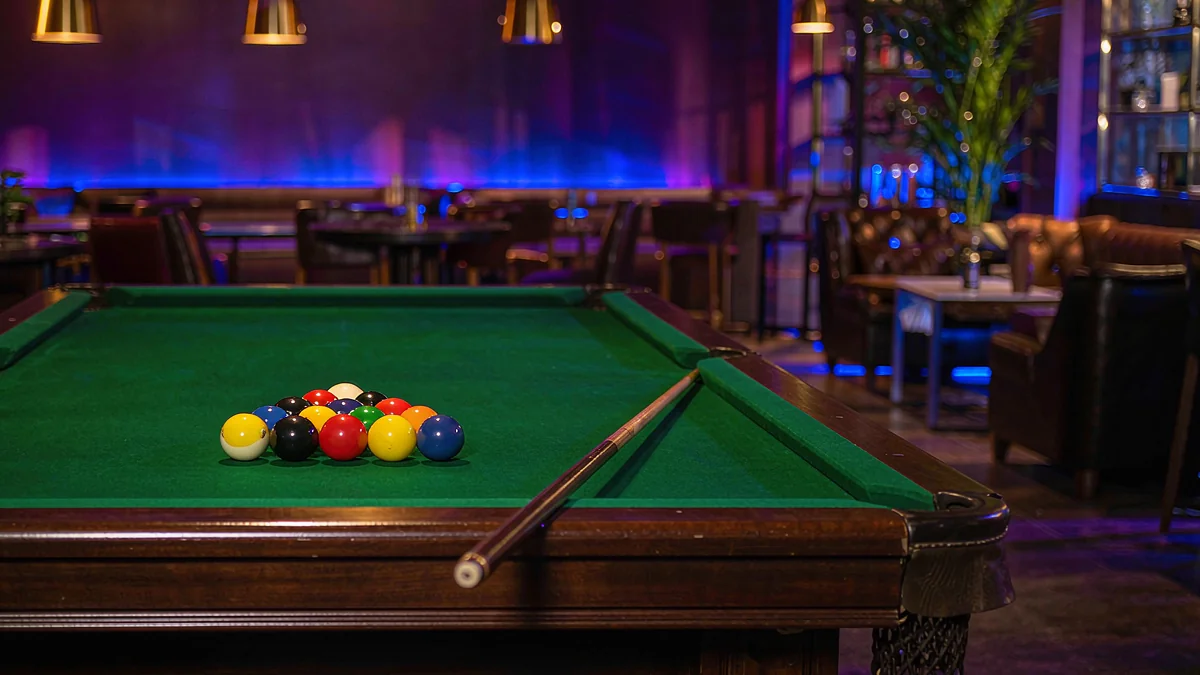 Billiard balls on a green pool table